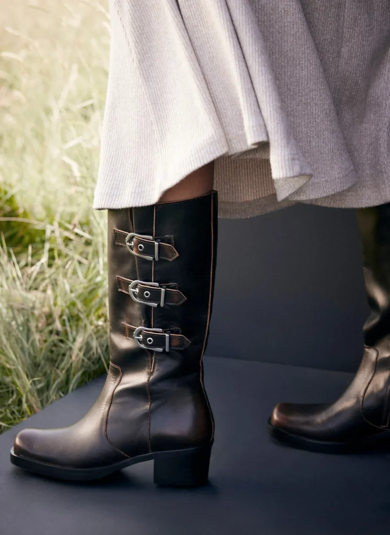 leather buckled long brown boots