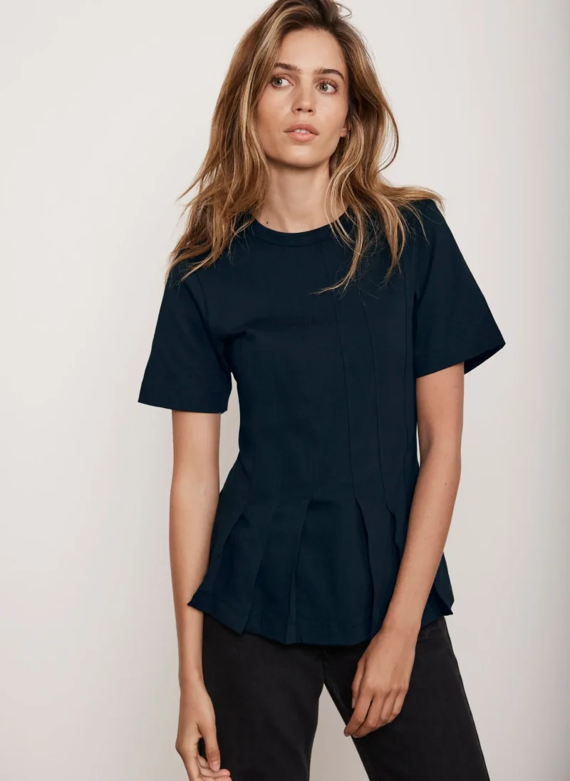 navy blue peplum top with seam details